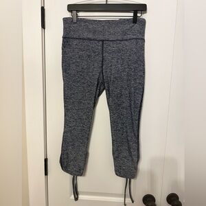 VOGO Athletica Heathers Navy Cropped Leggings with bow details.